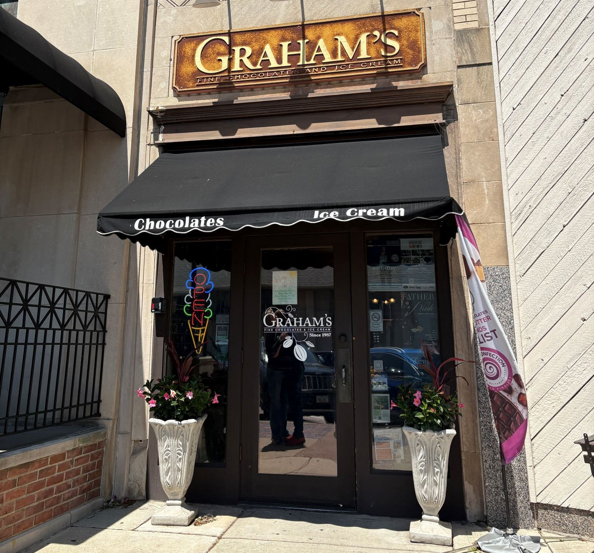  storefront with 'Graham's' sign and awning